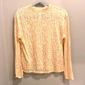 Sheer long sleeve athletic shirt.